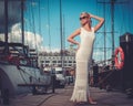 Stylish woman on a wooden pier