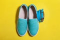 Stylish women blue slip on shoes and a belt