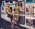 Stylish women on old boat Royalty Free Stock Photo