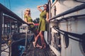 Stylish women on old boat