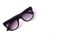 women`s black sunglasses on a white background. Female accessory Royalty Free Stock Photo