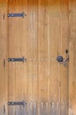 Stylish wooden door with metal ornaments Royalty Free Stock Photo