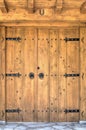 Stylish wooden door with metal ornaments Royalty Free Stock Photo