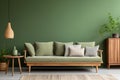 Stylish wooden sofa with green and grey cushions against green wall Royalty Free Stock Photo