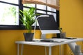 Stylish workplace with computer near window at home office Royalty Free Stock Photo