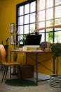 Stylish workplace with computer near window at home office