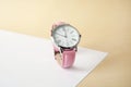 Stylish wrist watch on color background. Fashion Royalty Free Stock Photo