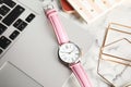 Stylish wrist watch and laptop on office table Royalty Free Stock Photo