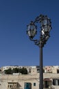 Stylish wrought iron street lamp with blue sky