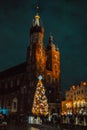 Stylish christmas golden illumination and Christmas tree. Krakow, Poland, Main Square and Cloth Hall in the winter Royalty Free Stock Photo