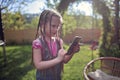 Girl chatting with friends with smartphone, virtual game during lockdown and after, new normal