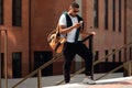 Young black man using phone walking in the city Royalty Free Stock Photo