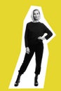 Stylish young blonde woman in black suit and rough boots. Full height. Black and white photo. Bright yellow background. Vertical Royalty Free Stock Photo