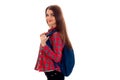 Stylish young brunette student girl with blue backpack looking and posing on camera isolated on white background Royalty Free Stock Photo