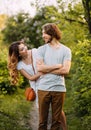 Stylish young couple. Film photo. Appearance and clothes for a photo shoot of a love story. The girl hugs the guy Royalty Free Stock Photo