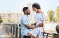 Stylish young couple hugging while walking in city Royalty Free Stock Photo