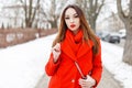 Stylish young girl in red scarf and coat Royalty Free Stock Photo