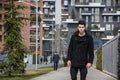 Stylish Young Handsome Man in Black Coat Standing in City Royalty Free Stock Photo