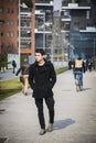 Stylish Young Handsome Man in Black Coat Standing in City Center Royalty Free Stock Photo