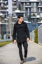 Stylish Young Handsome Man in Black Coat Standing in City Center