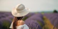 Stylish Young Lady In A White Hat On A Lavender Field