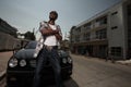 Stylish young male posing by a car Royalty Free Stock Photo