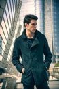 Stylish Young Man in Black Coat in City Center Street Royalty Free Stock Photo