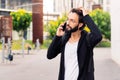 stylish young man talking worried on mobile phone Royalty Free Stock Photo
