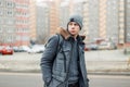 Stylish young man in a winter fashion jacket with a hat Royalty Free Stock Photo