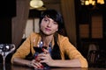 Stylish young woman drinking a glass of red wine Royalty Free Stock Photo