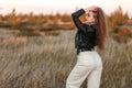 Woman at the grassland during a sunset