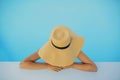 Stylish young woman in hat relaxing in blue pool and enjoying summer holiday. Girl in sunhat on vacation in luxury resort, Royalty Free Stock Photo