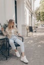 Stylish young woman posing in the street. Fashion summer photo