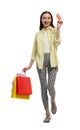 Stylish young woman with shopping bags and credit card white background Royalty Free Stock Photo