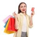 Stylish young woman with shopping bags and credit card white background Royalty Free Stock Photo