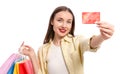 Stylish young woman with shopping bags and credit card white background Royalty Free Stock Photo