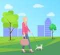 Stylish Young Woman Walking in Park with Small Dog Royalty Free Stock Photo