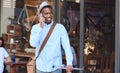 Stylish man standing with his bike talking on a cellphone Royalty Free Stock Photo