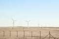 Stylishly practical windmills in the desert background