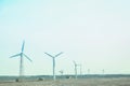 Stylishly practical windmills in the desert background