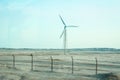 Stylishly practical windmills in the desert background