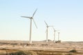 Stylishly practical windmills in the desert background