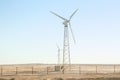 Stylishly practical windmills in the desert background