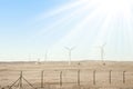 Stylishly practical windmills in the desert background