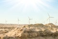 Stylishly practical windmills in the desert background