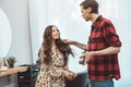 Stylist barber styling long hair for the beautiful asian young woman in beauty salon, working moment Royalty Free Stock Photo