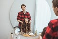 Stylist barber styling long hair for beautiful asian young woman in beauty salon, working moment Royalty Free Stock Photo