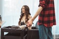 Stylist barber styling long hair with brush for the beautiful asian young woman in beauty salon, working moment Royalty Free Stock Photo