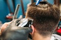 Stylist cut male head with trimmer closeup Royalty Free Stock Photo