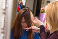 Stylist Cutting Bangs for Client with Brown Hair Royalty Free Stock Photo